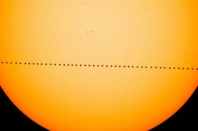 This is a photo of Mercury crossing in front of the sun.